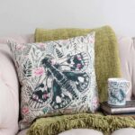 Thistle and butterfly cushion by Cherith Harrison.