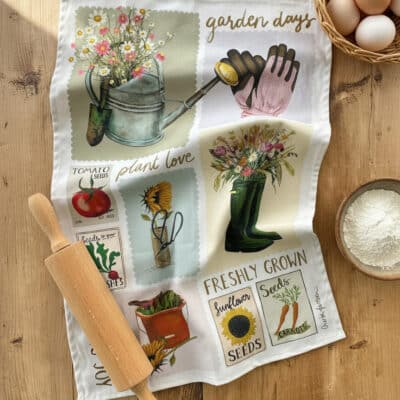 Garden Days Spring Gardening Tea Towel on Kitchen Table